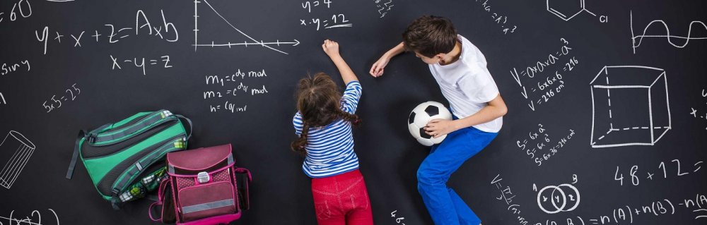 graphicstock cute boy and girl learning playfully in frot of a big blackboard rrgiscx6bz